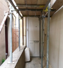 Doorway obscured by scaffolding